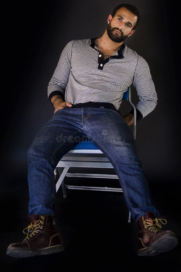 Young Man Sitting On A Chair Stock Photo Image of 