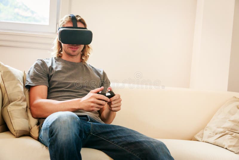 Young Man Sitting on Couch, Using Vr Glasses Stock Photo Image of