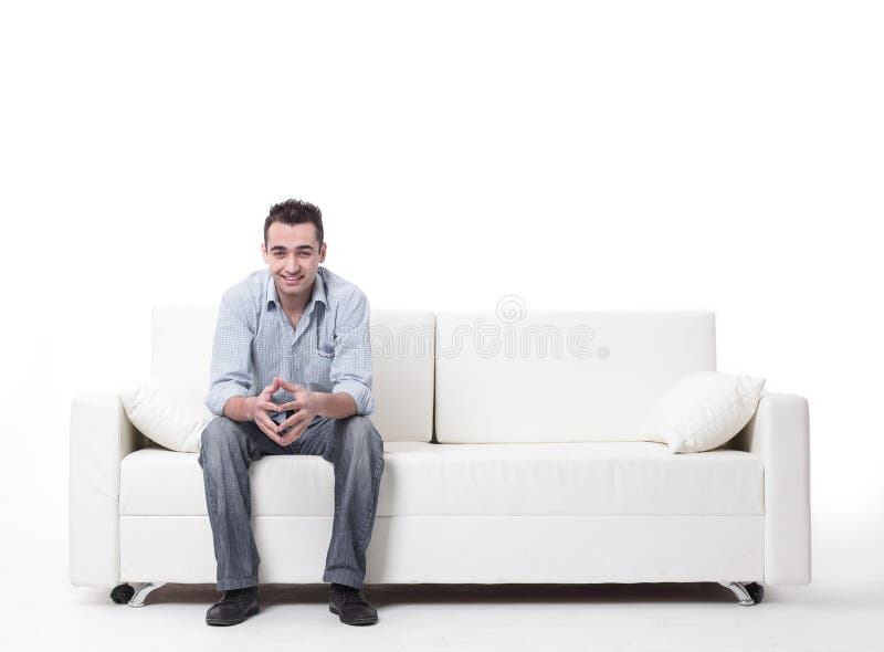 Young man sitting on a modern sofa