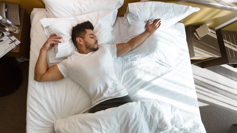 Man Stretching after Waking Up in Hotel Room Stock Photo - Image of ...