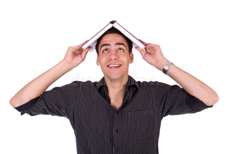 Young man smiling with book on his had