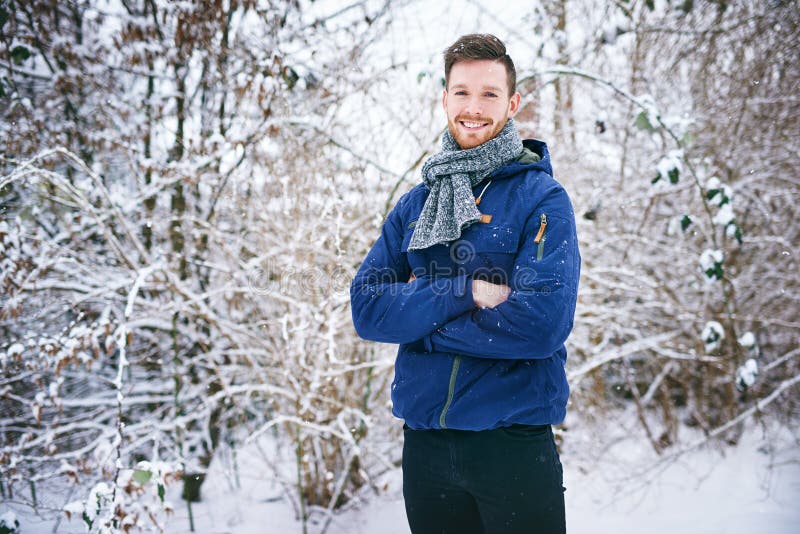 Young Man Smiling on Snowy Forest Background Stock Image - Image of ...