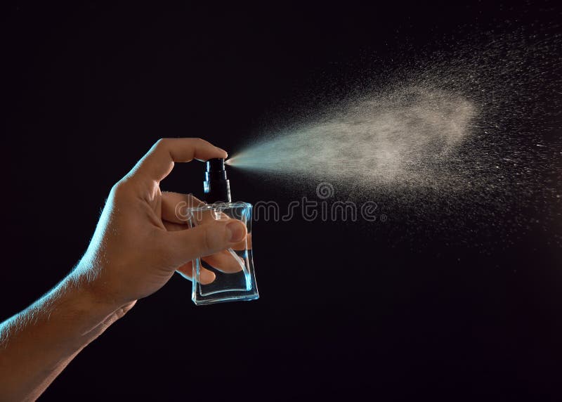 Young man spraying perfume stock image. Image of essence - 130561961
