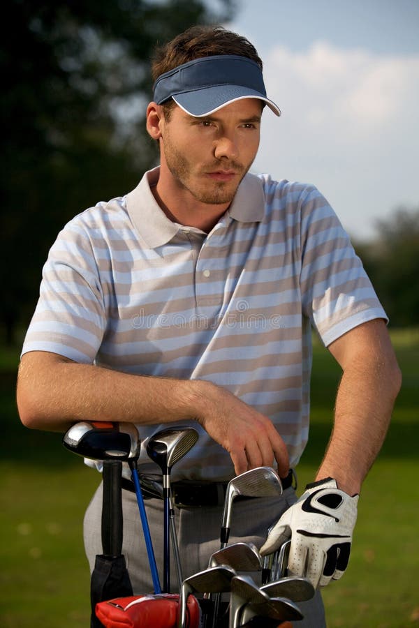 Young Man Standing by Golf Bag Full of Sticks Stock Photo Image of