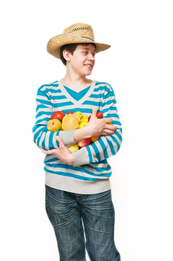 The young man in a straw hat with fruit