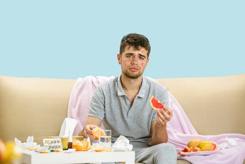 Young Man Suffering from Allergy To Citrus Fruits Stock Photo Image