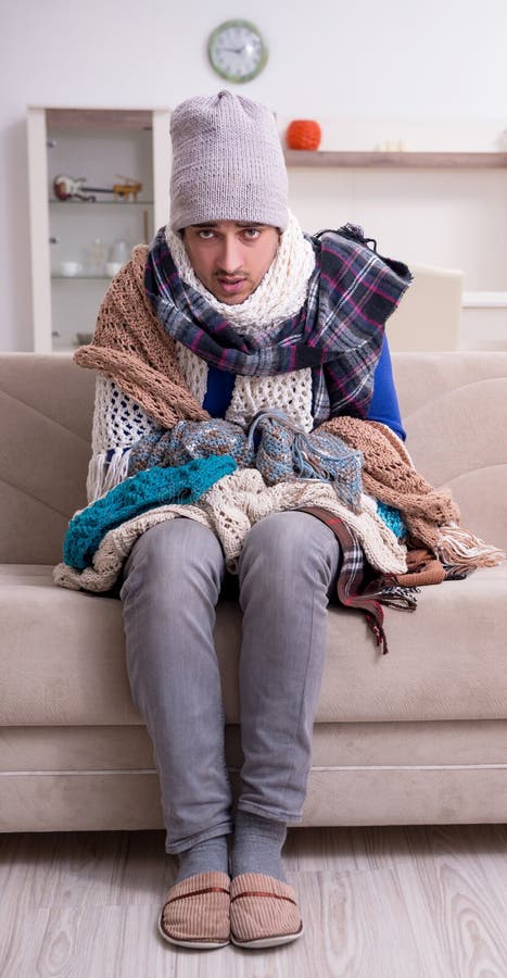 Young man suffering at home stock image