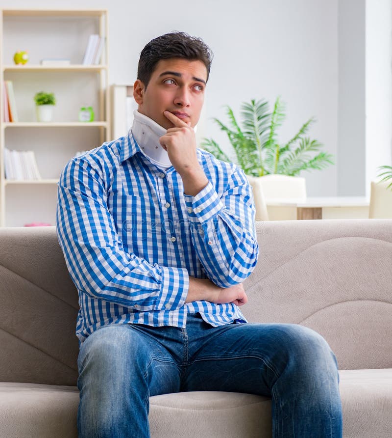 Young man suffering a neck spine head trauma wearing a cervical royalty free stock image Young man suffering a neck spine head trauma wearing a cervical royalty free stock image