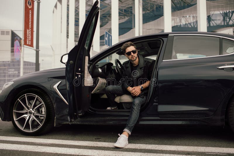 Young Man in Sunglasses Getting Out of Car in Town Stock Photo Image of happy, handsome 165233470