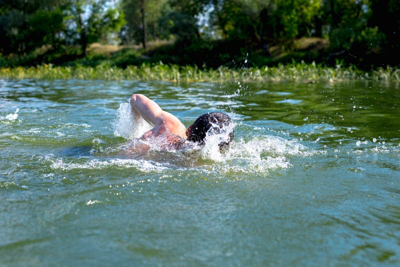 The Young Man Swimming in the River Stock Image Image of person