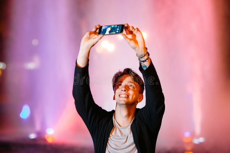 Young man take selfie on smartphone in city royalty free stock images Young man take selfie on smartphone in city royalty free stock images