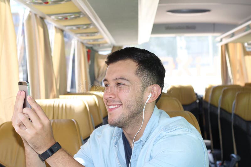 A Man is Sitting on the Bus Near a Glass Window with Steam Stock