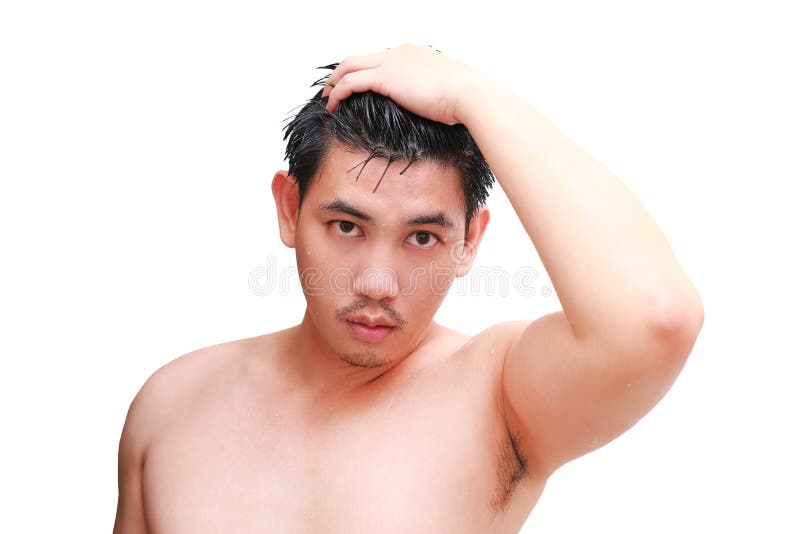 Young Man Taking a Shower and Standing Under Flowing Water in Bathroom