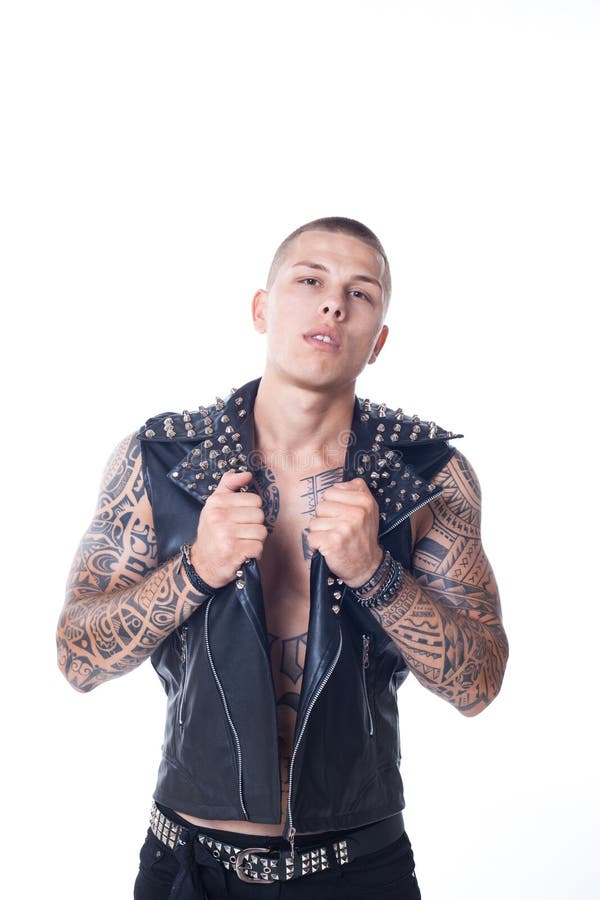Young Man with a Tattoo in a Black Leather Vest with Rhinestones and Black  Jeans Stock Photo - Image of stylish, belt: 123118340