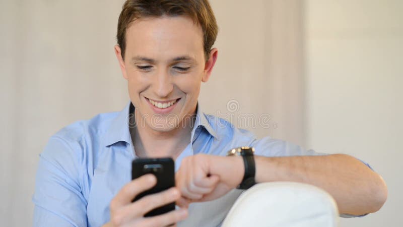 Young Man Texting On Cellphone