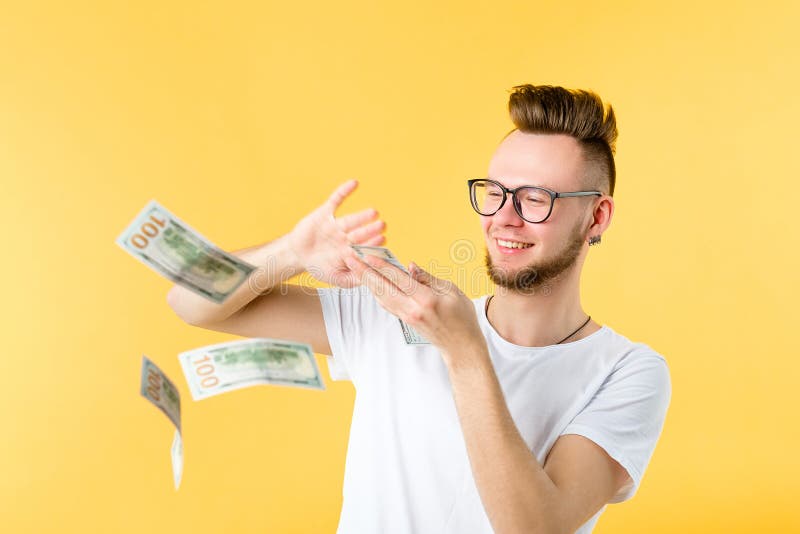 Young man throwing bills wealth money waste royalty free stock images Young man throwing bills wealth money waste royalty free stock images
