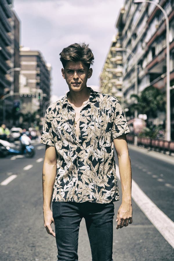 Young Man with Tough Guy Face Walking in the Middle of the Street Stock ...