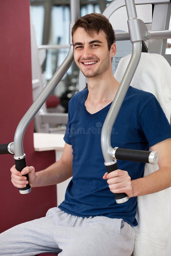 Young Man Training in the Gym Stock Image - Image of handsome, smile