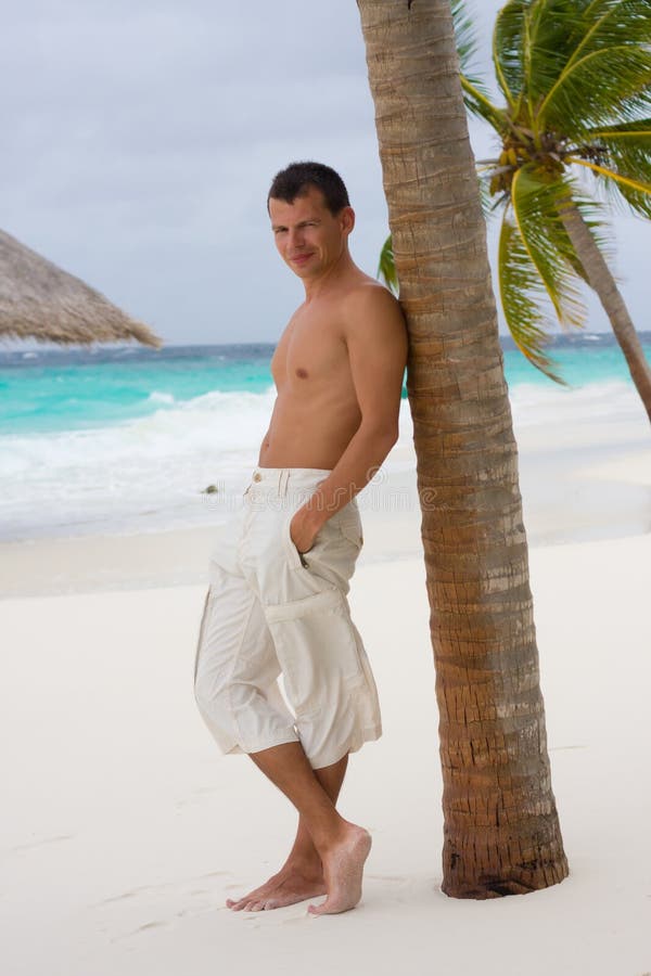 Young man on a tropical beach