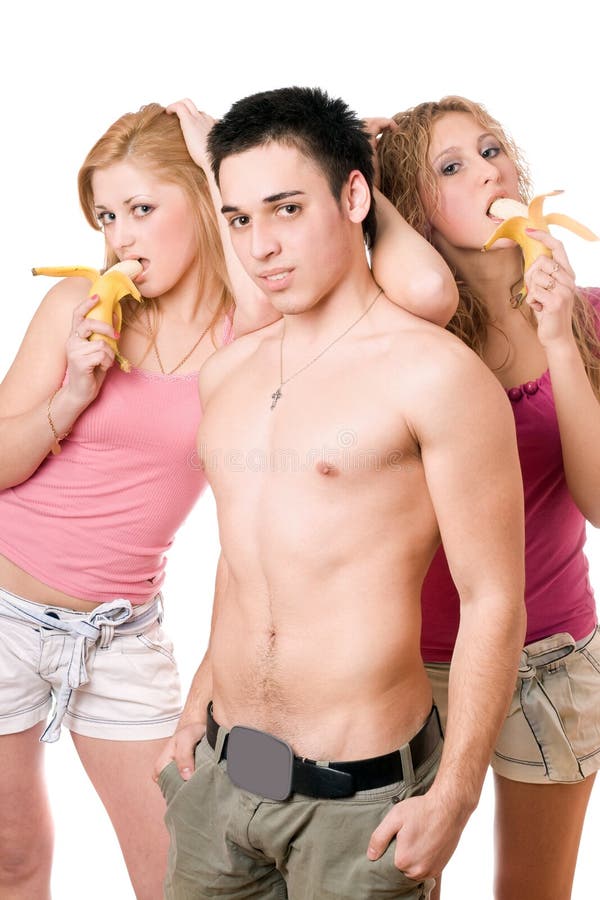 Young man and two beautiful women with bananas