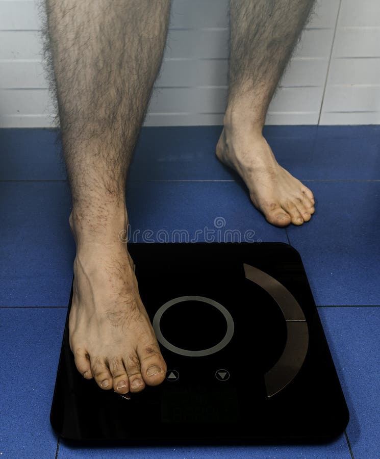 https://thumbs.dreamstime.com/b/young-man-uses-scale-body-weight-view-part-feet-young-man-using-scale-body-weight-control-health-concept-182048133.jpg