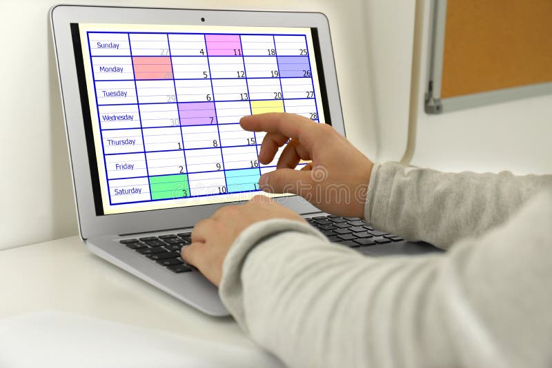 Young Man Using Calendar App on Laptop in Office Stock Image Image of Young Man Using Calendar App on Laptop in Office Stock Image Image of