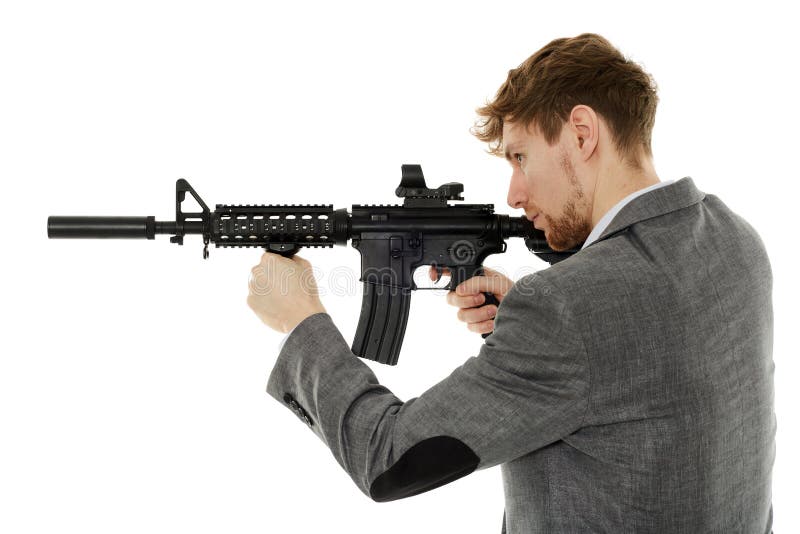 Young man using machine gun