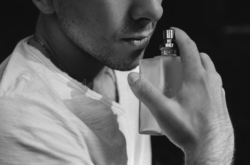 Young man using perfume stock image. Image of hand, person 98944753