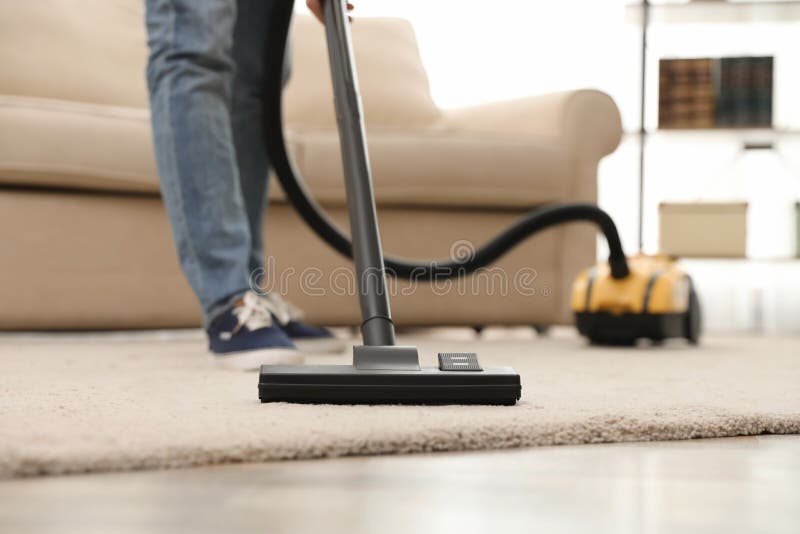 Young Man Using Vacuum Cleaner at Home Stock Image Image of