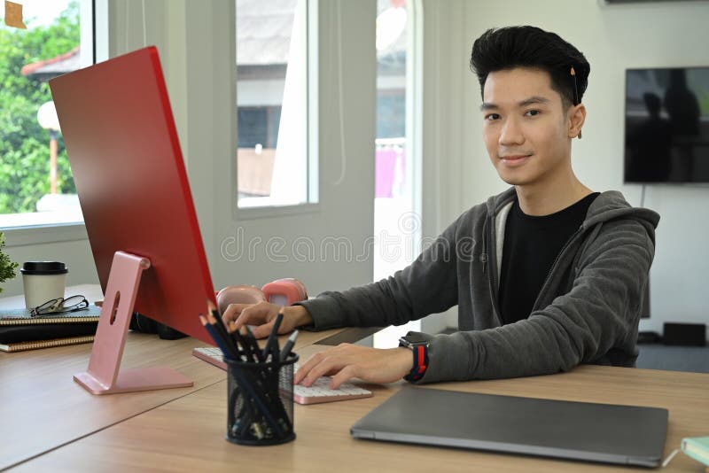 Young Man Video Editor Working with Footage and Post Production Montage