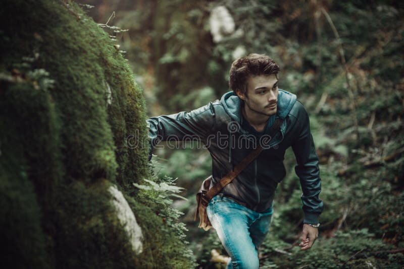Young man walking in the woods