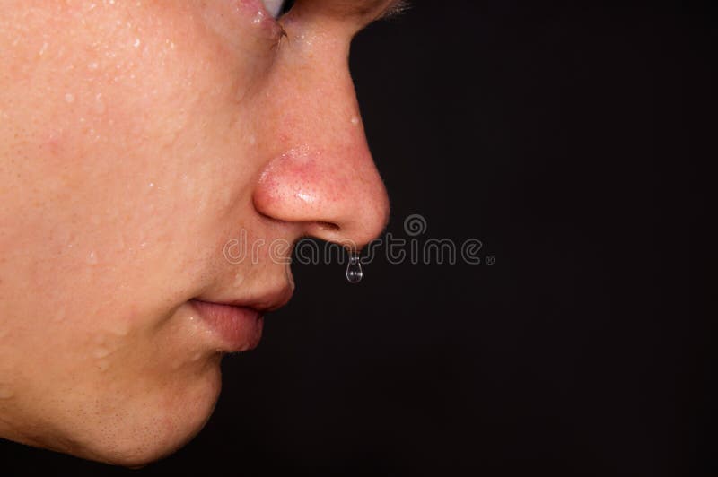 The young man was sweating, water dripping from his nose