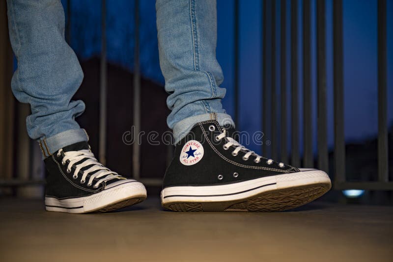 man wearing converse shoes