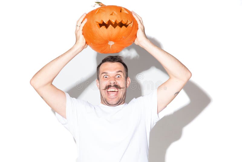 Young man holding pumpking on white background stock photography Young man holding pumpking on white background stock photography