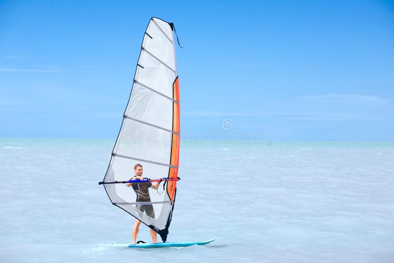 Young man on a windsurf