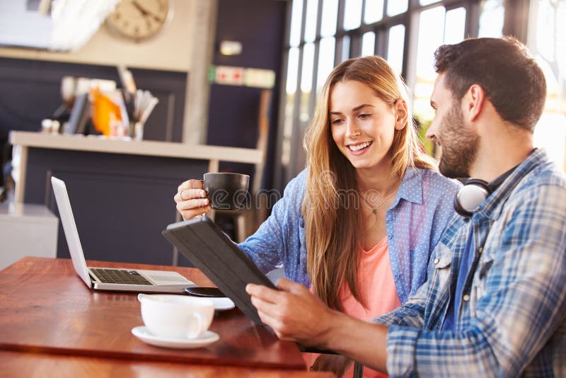 Young man and woman meeting at a coffee shop