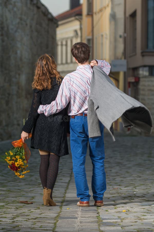 https://thumbs.dreamstime.com/b/young-man-woman-walking-away-together-men-women-has-bouquet-flowers-her-hand-throws-coat-over-his-shoulder-36700995.jpg