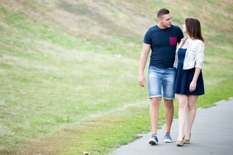 https://thumbs.dreamstime.com/b/young-man-woman-walking-together-beautiful-couple-date-wearing-casual-clothes-park-hugging-looking-each-other-59504789.jpg