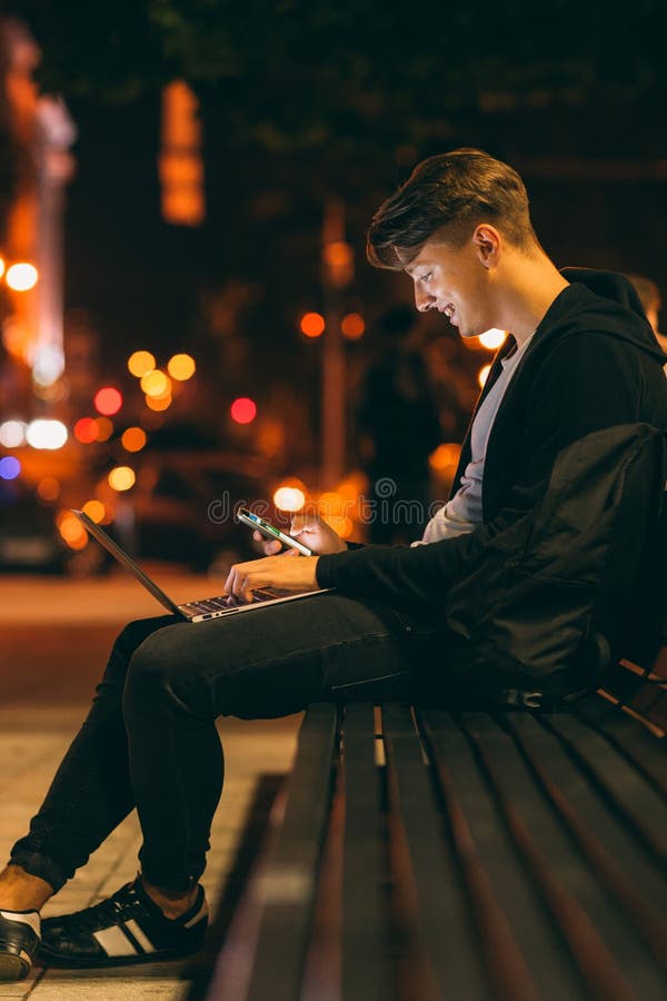 Young man work and communicate at night royalty free stock photography Young man work and communicate at night royalty free stock photography