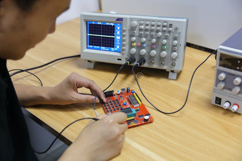 Electronic devices and Circuit board ,male electronic engineer using oscilloscope in laboratory stock photos Electronic devices and Circuit board ,male electronic engineer using oscilloscope in laboratory stock photos