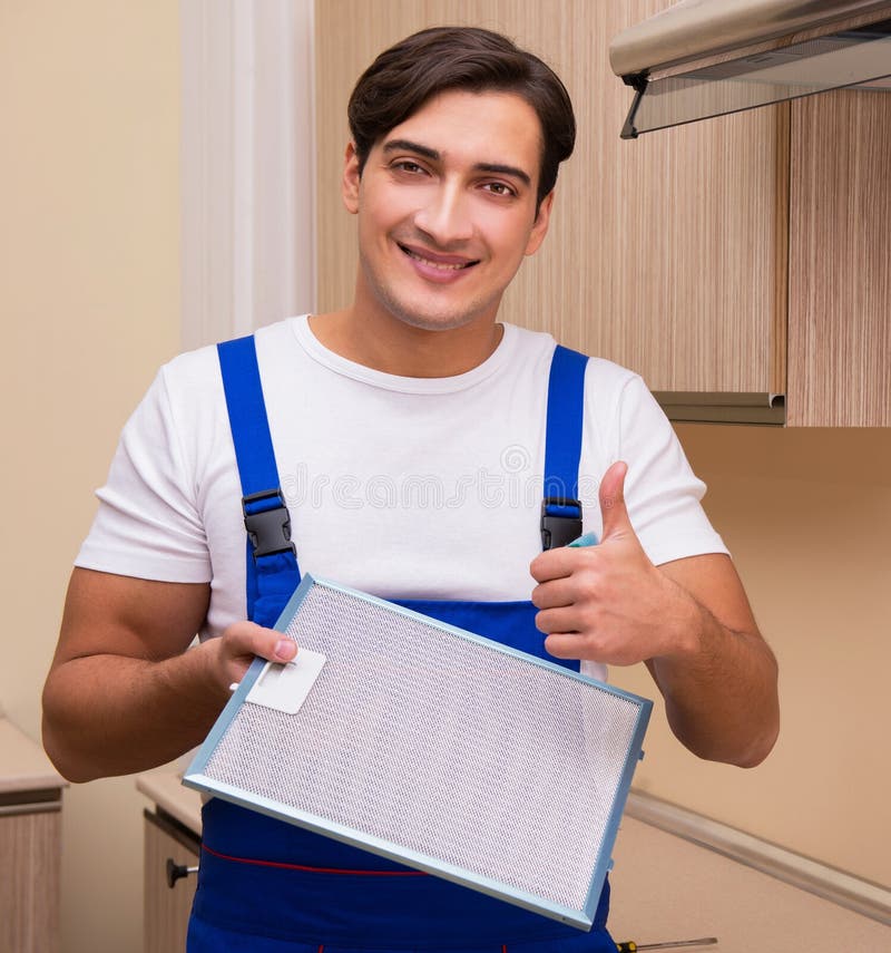 Young Man Working with Kitchen Equipment Stock Photo Image of
