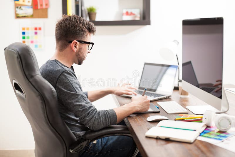 Young Man Working with Two Computers Stock Image Image of attractive