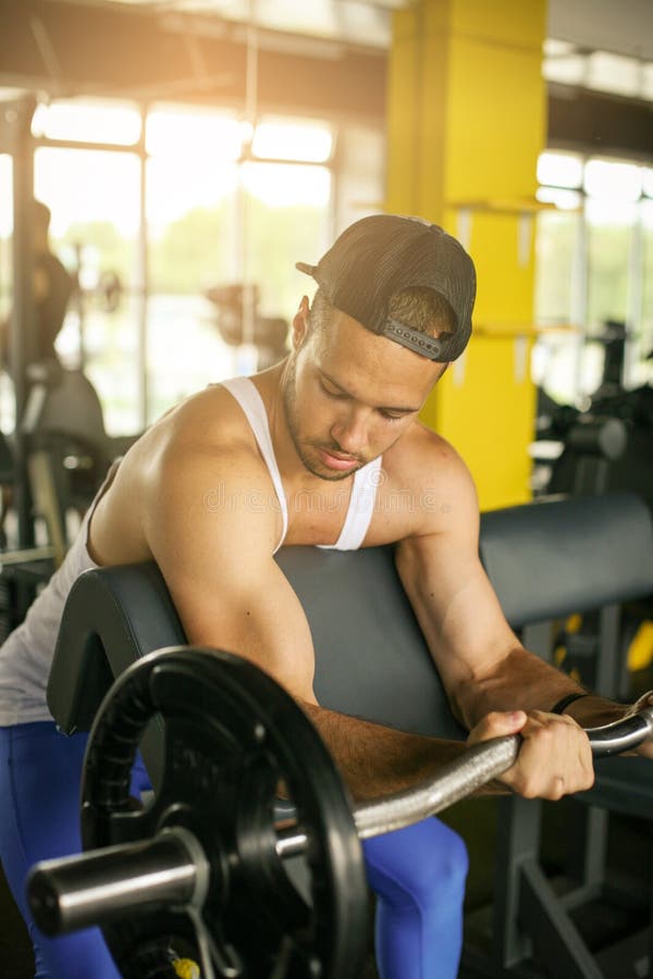 Young man workout in gym. stock photo. Image of sport 120375976