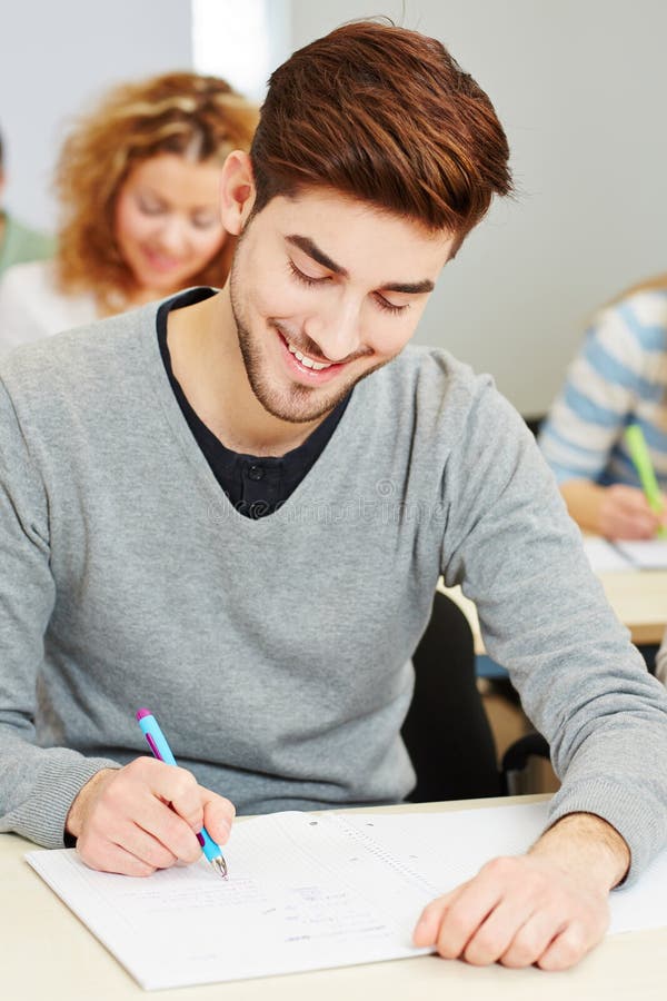 Mann taking exam in university royalty free stock photography