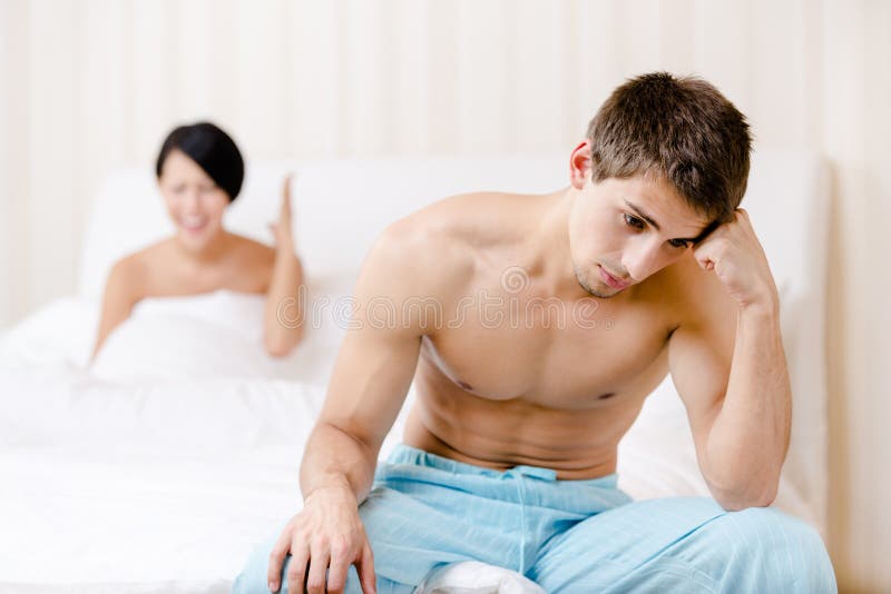 Young married couple argues in bed royalty free stock images