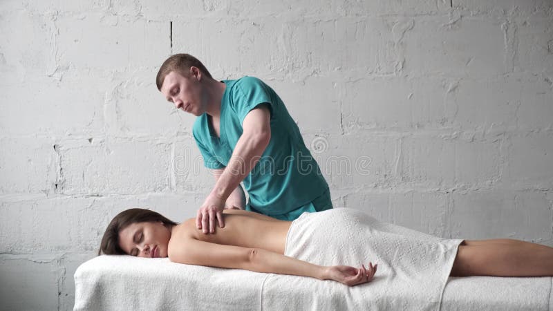 https://thumbs.dreamstime.com/b/young-masseur-doing-back-massage-dark-young-girl-massage-scoliosis-girl-gets-pleasure-relaxing-back-massage-young-masseur-172616142.jpg