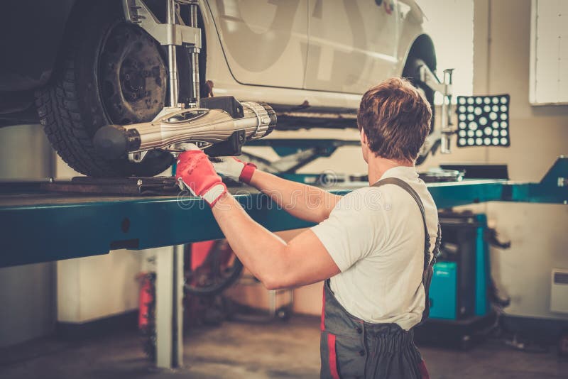 Young Mechanic in a Car Stock Image Image of angle