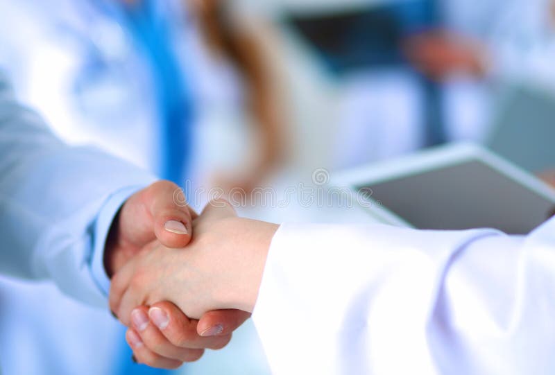 Young Medical People Handshaking at Office Stock Image Image of