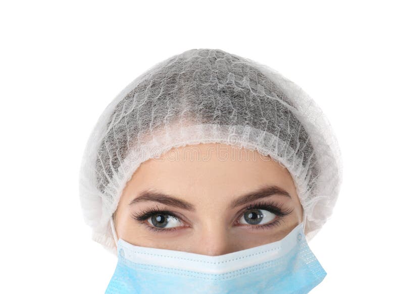 Young medical student with face mask and surgical cap on white background