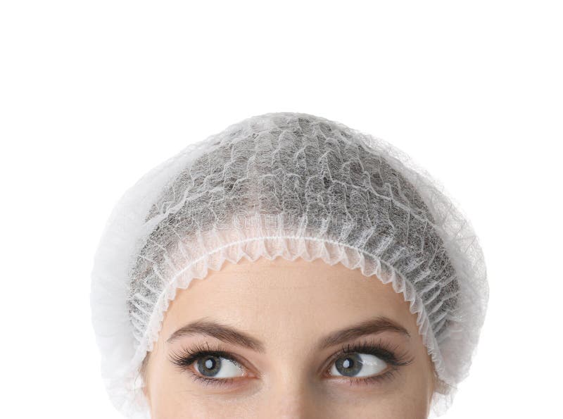 Young medical student in surgical cap on white background